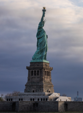  The Statue of Liberty standing on Liberty Island, New York, symbolizing freedom and welcoming visitors with her torch and classic design.