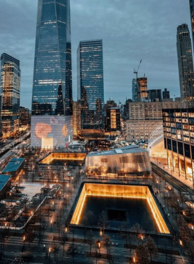 The National September 11 Memorial in New York City, with reflective pools and engraved names honoring the lives lost in the 2001 attacks.

