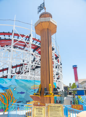 Belmont Park amusement park in San Diego, with its iconic wooden roller coaster and lively beachside attractions. The image captures the vibrant atmosphere of this historic park located along Mission Beach, where families enjoy rides, games, and ocean views. Belmont Park is a popular family-friendly destination and local landmark.