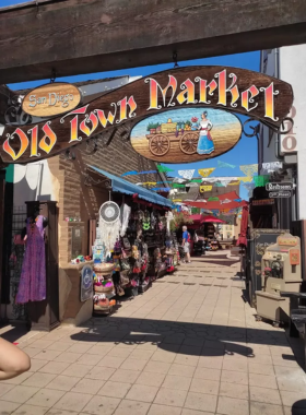 Side entrance to Old Town San Diego, featuring rustic adobe-style architecture and historic details. The image captures the authentic charm of this historic district, showcasing its preserved architecture and cultural atmosphere. Old Town is a popular destination for visitors seeking a glimpse into San Diego's early history and Mexican heritage.