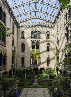 The main lobby of the Isabella Stewart Gardner Museum in Boston, showcasing its unique architecture and art displays. The museum is renowned for its beautiful art collections and the famous 1990 art heist.