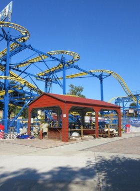 The thrilling RockStar Roller Coaster, an adrenaline-pumping amusement ride with steep turns and rapid drops, popular among thrill-seekers at this entertainment park.