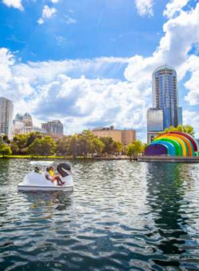  A scenic view of a Florida conservation area with lush palm trees, grasslands, and a serene lake, capturing the natural beauty and biodiversity of Florida's protected landscapes.