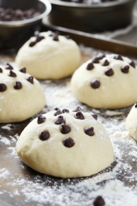 Adding Toppings to Rolo-Stuffed Chocolate Chip Cookies