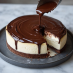 Pouring ganache over the chilled Ultimate Chocolate Cheesecake before serving