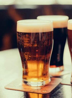 This image shows a cozy local brewery in Fort Lauderdale, with craft beer being poured into glasses, offering a glimpse into the city’s growing craft beer scene and laid-back atmosphere.