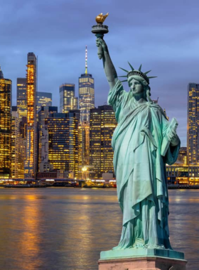 A classic view of the Statue of Liberty, symbolizing freedom and democracy, with boats passing by in the foreground.