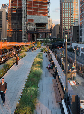 A beautifully landscaped section of the High Line in New York City, illustrating its elevated gardens and urban art installations.