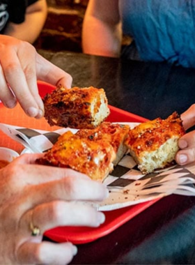 A group of participants on a secret food tour in New York, savoring local delicacies and experiencing the city's culinary culture.