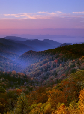 A breathtaking image from National Geographic highlighting the stunning landscape of the Smoky Mountains. The image captures the majestic peaks and vibrant foliage, showcasing the natural beauty of this iconic region.