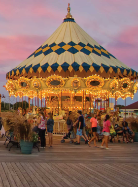 A vibrant shopping area at Barefoot Landing in Myrtle Beach, featuring shops, restaurants, and scenic walkways along the water. Visitors can enjoy a variety of dining options and entertainment in a picturesque setting.