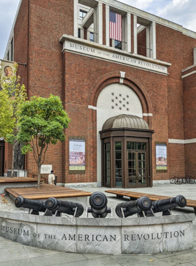 The grand entrance to the Museum of the American Revolution in Philadelphia, with its stately columns and historical architecture. The museum is dedicated to telling the story of America’s revolutionary history.