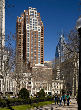 A stunning architectural view of the modern Philadelphia skyline, featuring sleek buildings and a clear blue sky. The photo captures the essence of urban sophistication and the dynamic cityscape.