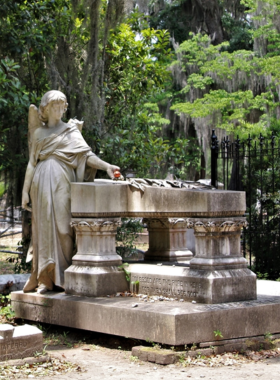  "Bonaventure Cemetery in Savannah, a serene site with Victorian-style gravestones, moss-covered trees, and historic statues."