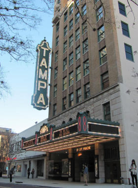 The ornate interior of Tampa Theatre, showcasing its grand chandelier, red velvet seating, and detailed architecture that provides a vintage movie-going experience.