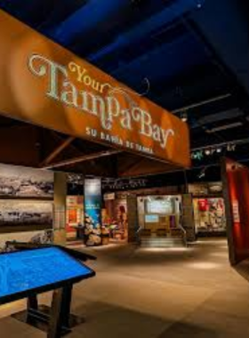 Visitors exploring an interactive exhibit at the Tampa Bay History Center, learning about the history of Tampa and its diverse cultures through engaging displays and hands-on activities.

