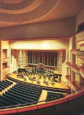 This image shows that people are watching a live performance at the Blumenthal Performing Arts Center, experiencing an engaging theater production with impressive stage designs and world-class performances.