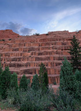 This image shows the striking red sandstone formations of Red Rock Canyon Open Space, with visitors hiking along the trails and enjoying the scenery.