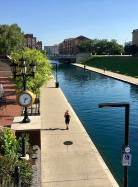 "This image shows the White River State Park with Indianapolis city skyline in the background, blending nature with urban views."
