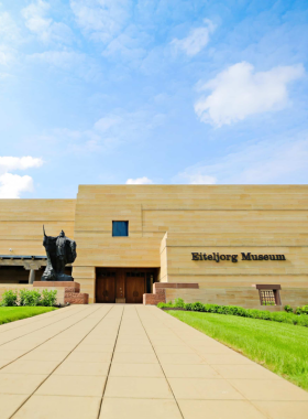  "This image shows the Eiteljorg Museum’s unique architecture, with Native American art sculptures outside welcoming visitors."