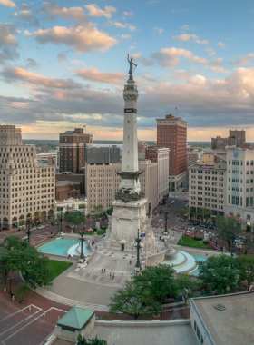 This image shows the Soldiers and Sailors Monument with its towering statue, fountains, and surrounding city buildings."