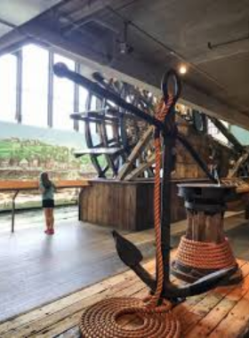  "This image shows a collection of 19th-century artifacts recovered from the Arabia Steamboat wreck, including old household items and tools that showcase life during the pioneer era."