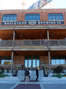 "This image shows the cozy tasting room at Boulevard Brewing Company, where visitors can enjoy samples of craft beer while seated at the wooden bar."