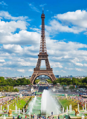 This image shows that the Eiffel Tower stands tall in Paris, showcasing its intricate iron lattice structure against a clear sky, symbolizing French innovation.