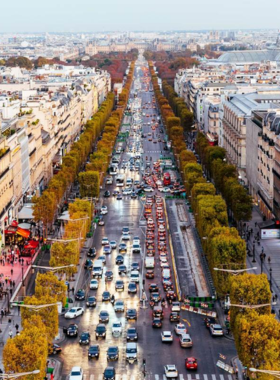 This image shows that the Champs-Élysées Boulevard is lined with cafes and shops, bustling with people enjoying the iconic Parisian atmosphere.