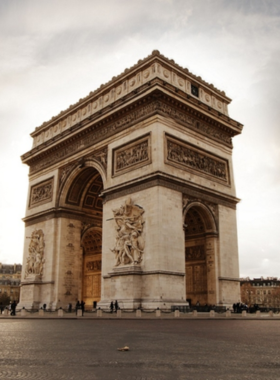 This image shows that the Arc de Triomphe stands as a grand monument in Paris, honoring French soldiers with engraved names and historic sculptures.