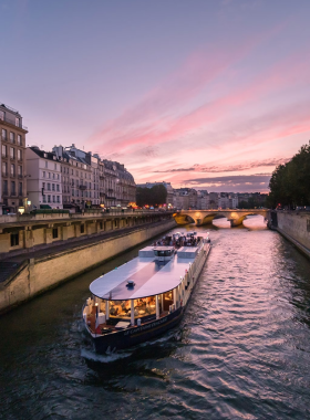 This image shows that the Seine River flows peacefully through Paris, with historic bridges and scenic riverbanks, perfect for boat rides and sunset views.

