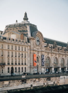 This image shows that the Musée d’Orsay’s former railway station architecture houses famous art, with its iconic clock window overlooking the city.