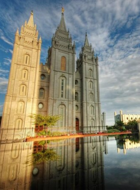 "This image shows that Temple Square in Salt Lake City is surrounded by beautiful gardens and historic buildings under a clear sky."