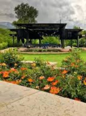 : "This image shows that Red Butte Garden has a scenic path lined with vibrant flowers and greenery for peaceful strolls."