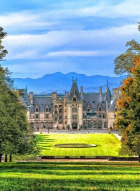 "This image shows the beautifully landscaped gardens of Biltmore Estate, with vibrant flowers, neatly trimmed hedges, and scenic pathways."