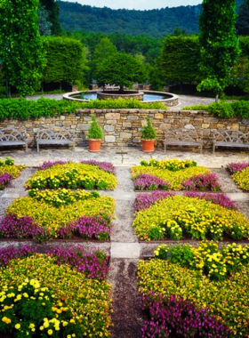 "This image shows a lush landscape at the North Carolina Arboretum, featuring vibrant plant collections and walking trails."