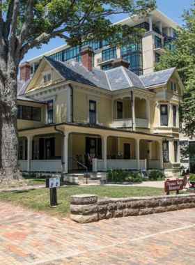 "This image shows the Thomas Wolfe Memorial, a historic house museum dedicated to the famous author, with a glimpse of the house’s interior."