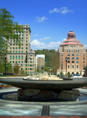  "This image shows the vibrant downtown streets of Asheville, lined with shops, restaurants, and people enjoying the lively atmosphere."