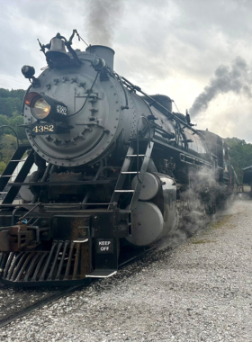 This image shows a historic train at the Tennessee Valley Railroad Museum. The image reflects the museum's dedication to preserving rail history with vintage train rides and exhibits.