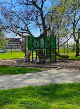  "This image shows Goodale Park in Columbus, Ohio, with scenic lakes, large green spaces, flowering plants, and walking paths, where visitors enjoy outdoor relaxation and family-friendly events surrounded by natural beauty."