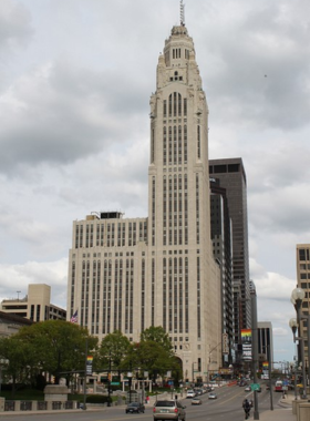 "This image shows LeVeque Tower in Columbus, Ohio, a historic art-deco skyscraper with stunning architecture, a luxury hotel, and restaurant, symbolizing the city’s rich architectural heritage and modern hospitality."