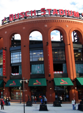 "This image shows Busch Stadium during a lively Cardinals game, with fans filling the seats and the field ready for play. The stadium atmosphere is full of excitement, making it a must-visit spot for sports enthusiasts and baseball fans."