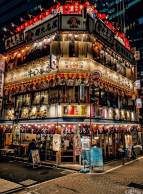 This image shows the upscale Ginza district in Tokyo, filled with high-end boutiques, luxury stores, and modern architecture. Shoppers are seen walking along the wide streets, exploring stylish fashion brands, and enjoying the sophisticated atmosphere of one of Tokyo’s most famous shopping areas.