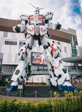 This image shows Odaiba, a futuristic entertainment and shopping district in Tokyo. The modern architecture, large shopping malls, and attractions like the giant robot statue make Odaiba a popular destination for visitors looking to explore high-tech, futuristic experiences in Tokyo.

