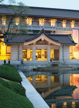 This image shows the Tokyo National Museum in Ueno, with its extensive collection of ancient Japanese artifacts on display. Visitors are seen exploring the exhibits, which include samurai armor, pottery, and traditional Japanese art, offering a deep dive into Japan’s rich cultural history.