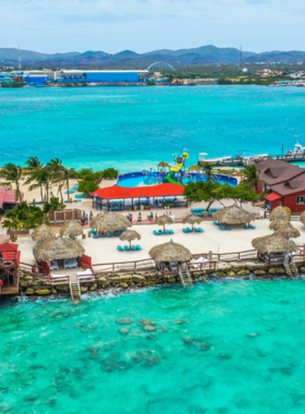 This image shows that De Palm Island in Aruba is a family-friendly resort, offering water slides, snorkeling, and zip-lining, making it a great destination for all ages to enjoy.