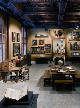 This image shows the interior of the Walters Art Museum, featuring intricate sculptures, paintings, and historical artifacts displayed in a well-lit, organized gallery setting, reflecting its rich cultural significance