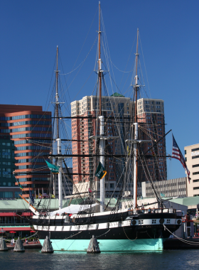 This image shows the USS Constellation docked at Baltimore’s Inner Harbor, part of the Historic Ships exhibit, reflecting the city’s rich naval history and maritime heritage.