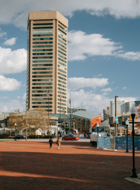 This image shows the iconic Washington Monument in Mount Vernon Place, surrounded by beautifully landscaped gardens and historic buildings, showcasing Baltimore’s architectural and cultural elegance.