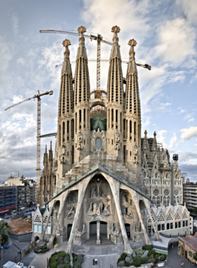 This image shows the iconic Sagrada Família in Barcelona, a famous basilica designed by Antoni Gaudí, known for its unique architecture with towering spires and intricate details.

